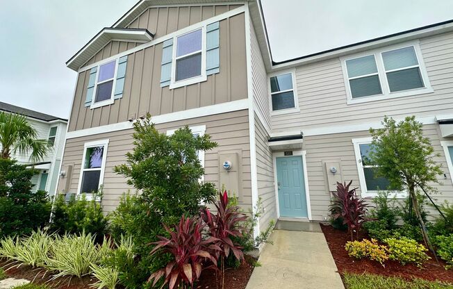 Welcome to this beautifully designed, open-concept townhome featuring a screened-in patio,