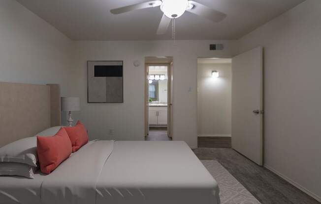 This is a photo of a virtually staged primary bedroom room in the 970 square foot 2 bedroom, 2 bath apartment at Preston Park Apartments in Dallas, TX