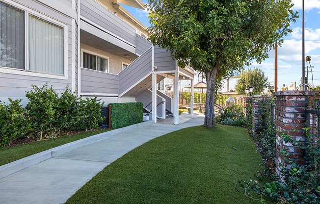 Exterior walking path in gated patio area.