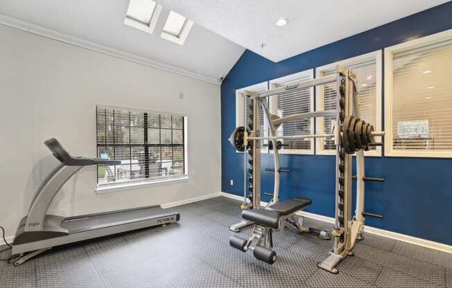 Gym with weights and cardio machines at Woodmere Trace at Duluth, GA