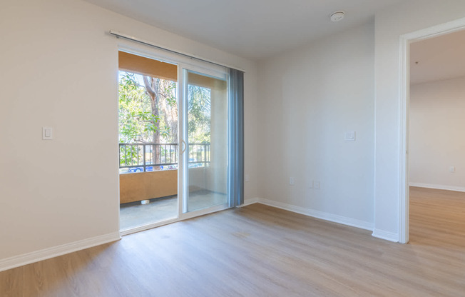 Bedroom with Balcony and Hard Surface Flooring