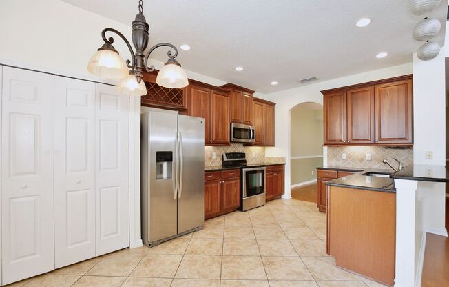 Elegant 3/3 Spacious Townhome with a 2 Car Garage in the Gated Greystone Community - Sanford!