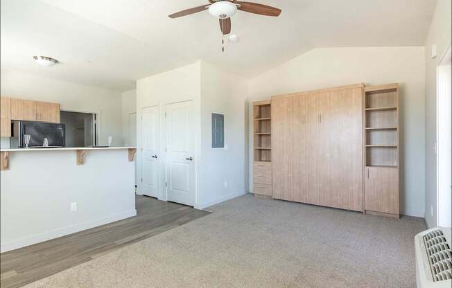 A living room with a ceiling fan and a television at Forestplace Apartment Homes, Forest Grove, 97116