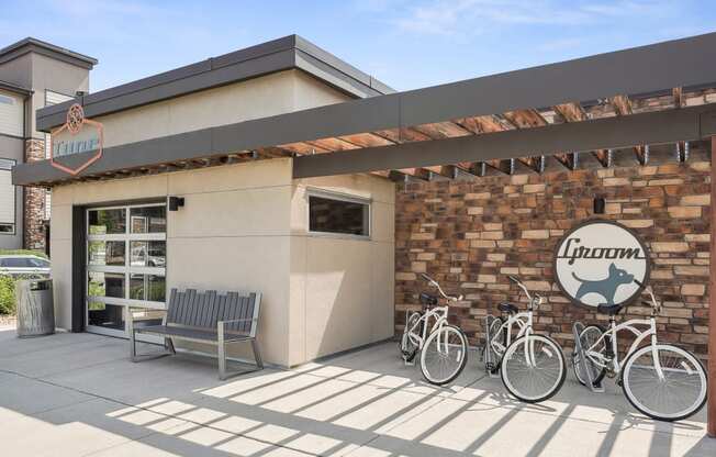 a building with three bikes parked outside of it