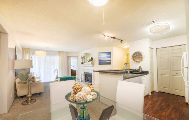 a living room and kitchen with a table and chairs and a kitchen counter top at Butternut Ridge, North Olmsted, OH, 44070