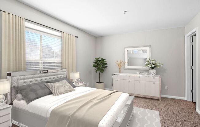 A bedroom with a large bed, a dresser, and a window with curtains.