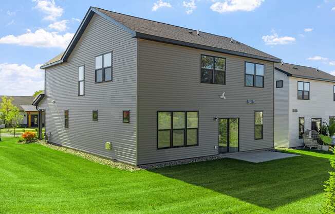 a large house with a yard in front of it