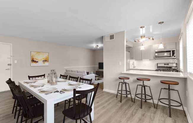 an open kitchen and dining room at Flats of Forestville, Forestville, Maryland 20747