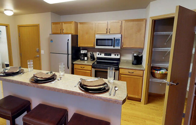 a kitchen with a center island and a stove top oven