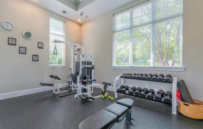 gym area with large window and weight equipment