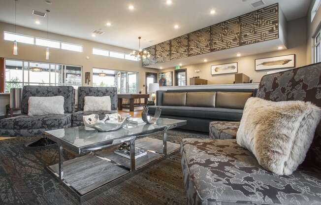 Decorative sofa chairs and glass coffee table in middle of clubhouse