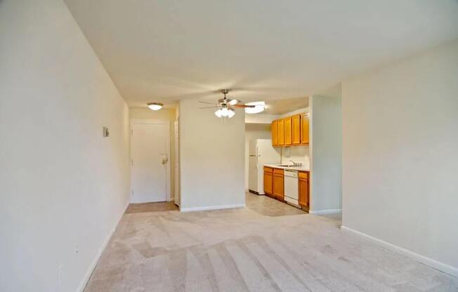 View of living area, kitchen, and entrance at Broadfalls in Falls Church, VA