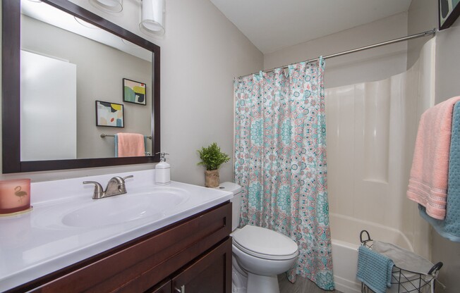 Bathroom with single sink and toilet at St. Croix Apartments in Virginia Beach VA
