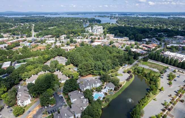 A bird's eye view of a residential area with a river running through it.