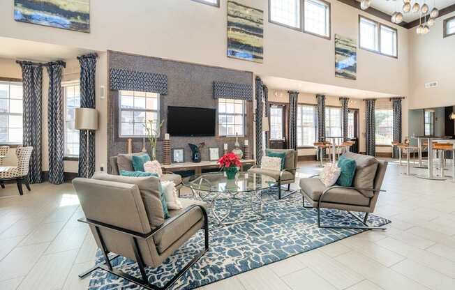 A living room with a fireplace and a television.