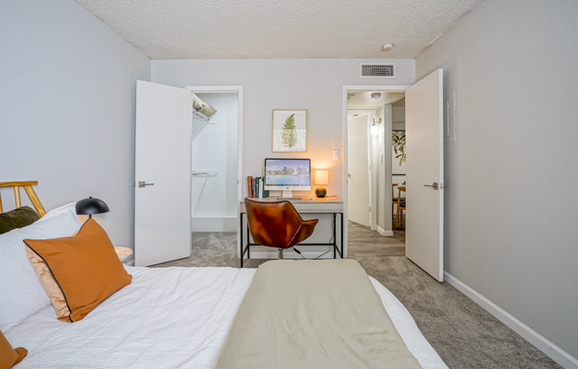 Furnished platinum bedroom interior with workspace at Treehouse in Albuquerque, New Mexico