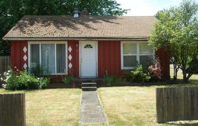 House with garage, carport, yard, & shed