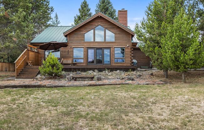 Log home on 3.57 riverfront acres with stunning view! Furnished