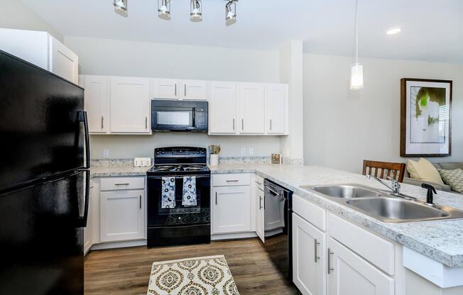 a kitchen with a stove and a sink