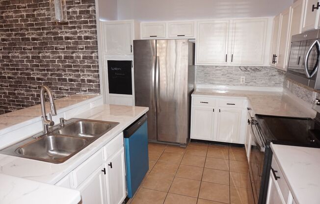 Designer 3/2 with 2 Car Garage in Desirable Location