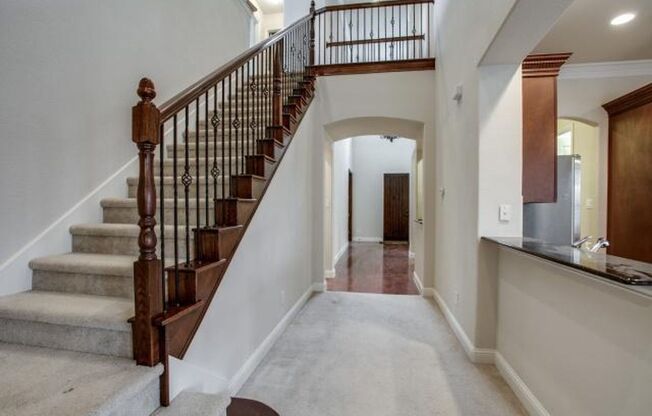 Bright and airy living room, fireplace, study, custom lighting in the formal living and dining.