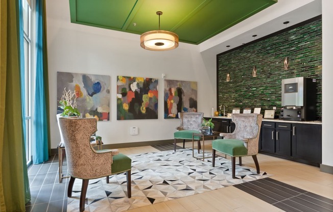 a living room with a green ceiling and a table with chairs