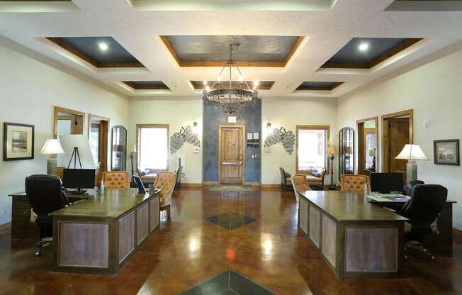 A large room with a long table and chairs.