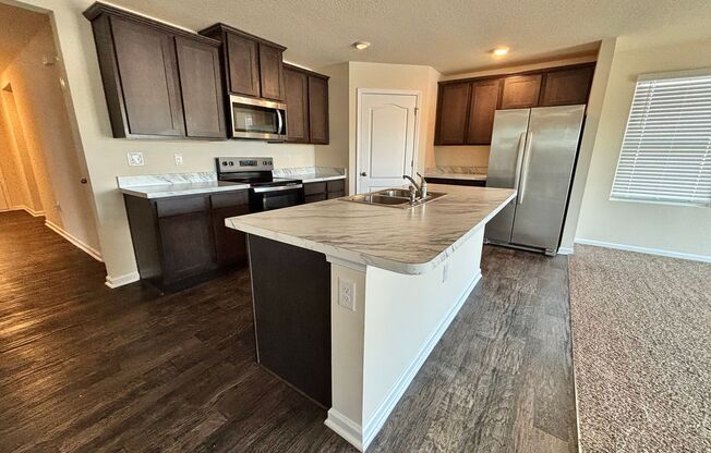 Beautiful 4 Bed 3 Bath Home. Move-In Ready with Amenities. Double Garage. Peaceful Water View! Washer Dryer Included!