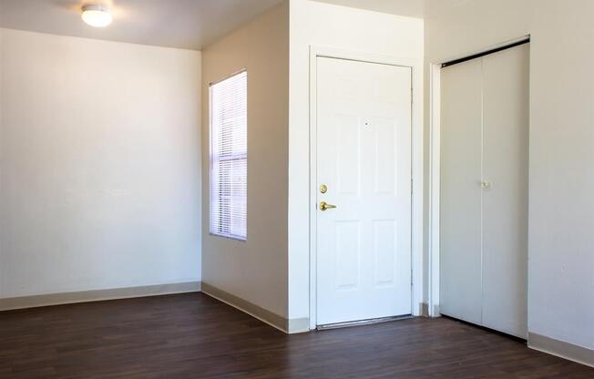 Living Room Entry with Hardwood Style Flooring and Window