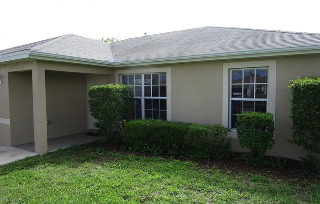 PRICE REDUCTION: Freshly Painted: 3 bedroom 2 bathroom single family home with screened lanai