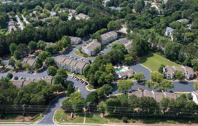 A residential area with houses and a roundabout.