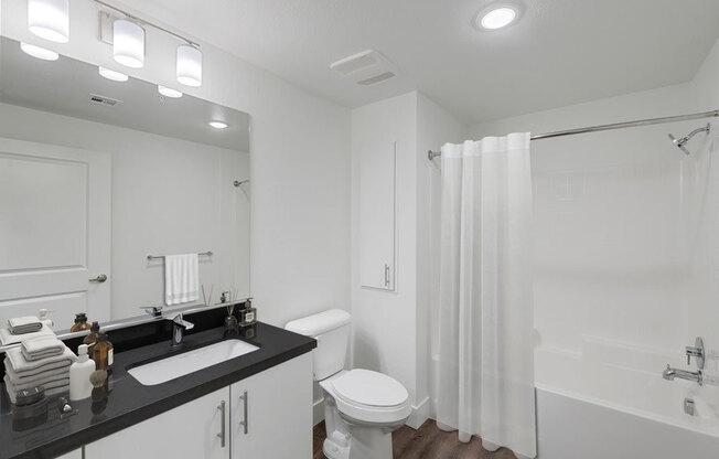 Model bathroom with modern white vanity