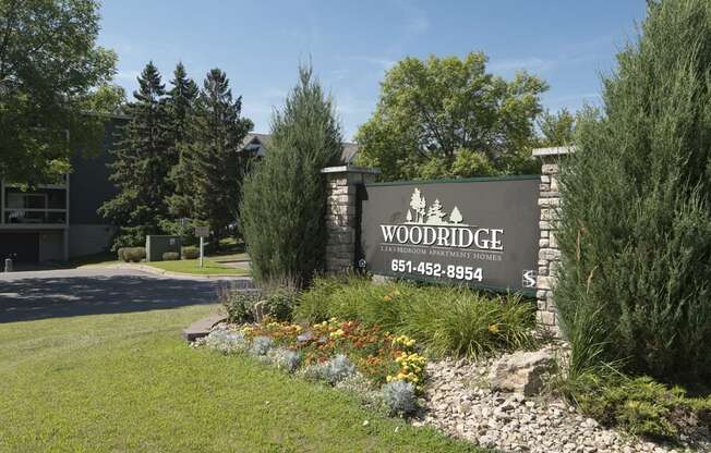 Outdoor sign that reads "Woodridge Apartments"