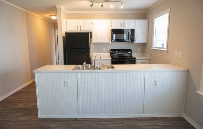 Beautiful kitchen in Deerbrook Apartment homes with spacious countertops and overhead lighting