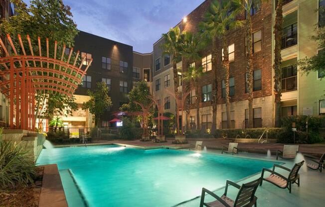 night time exterior of office and pool at The Core, Houston