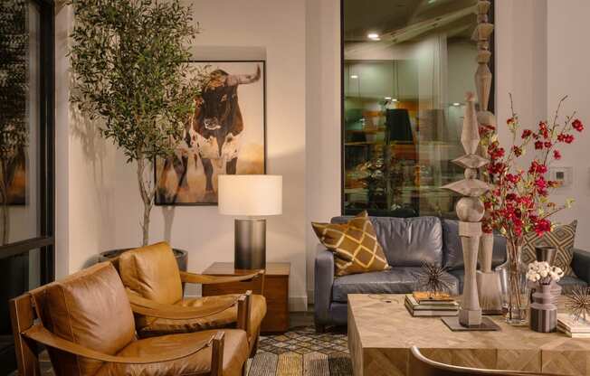 a living room with leather furniture and a large mirrorat Weylyn Luxury Apartments, Arizona, 85339