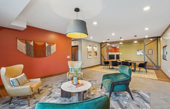 A living room with a green chair and a coffee table.