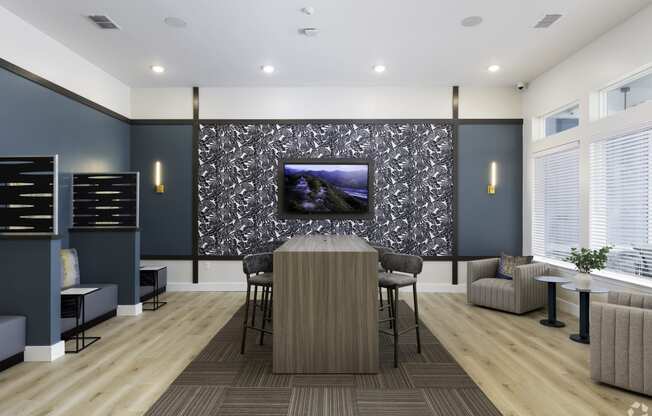 a conference room with a table and chairs and a tv on the wall