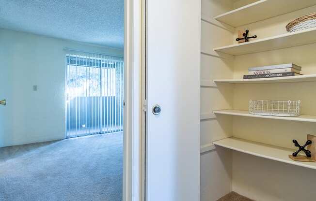 Cottonwood Creek apartment with cream colored linen closet. 