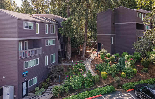 A building with a parking lot in front of it.