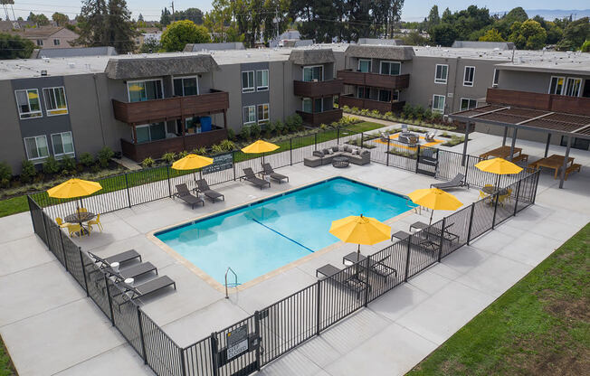 Pool with lounge chairs l Fremont Ca Apartments for rent