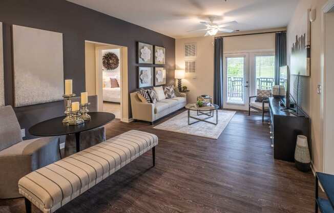 Living Room With Oversized Windows And Doors at Abberly CenterPointe Apartment Homes by HHHunt, Virginia