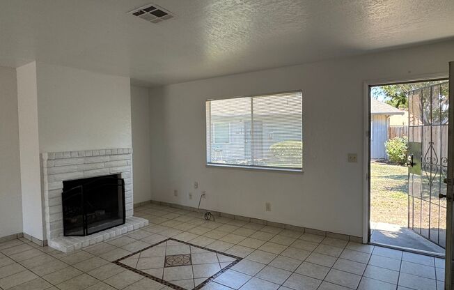 Two Bedroom Triplex with One Bathroom and Garage