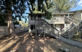 Cozy 1 Bedroom Condo with Forest-Like Setting, Decorative Fireplace & Charming Patio