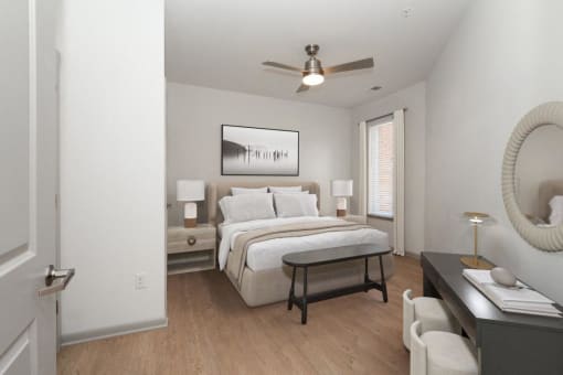 a bedroom with a bed and a ceiling fan at The Waterford At Rocketts Landing Apartments, PRG Real Estate, Richmond, Virginia