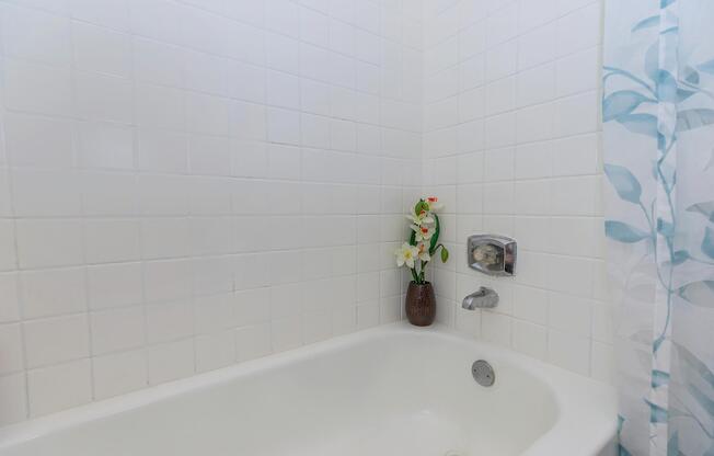 a close up of a sink and a bath tub