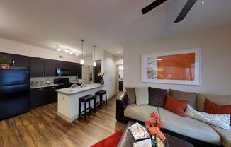 a living room filled with furniture and a flat screen tv