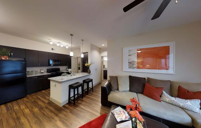 a living room filled with furniture and a flat screen tv