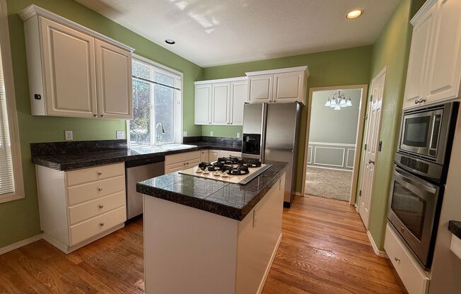 12540 NW Brimpton Court ~ Elegant Bethany Home with NEW Carpet & Fresh Paint