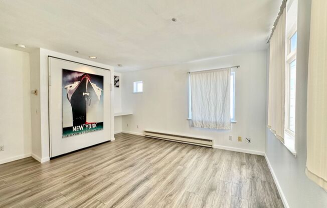 Epic REA: Bright Top Floor Corner Studio with Built-in Murphy Bed in SOMA